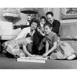 Posterazzi SAL2556217 Parents with Three Children Relaxing in Living Room Poster Print - 18 x 24 in.