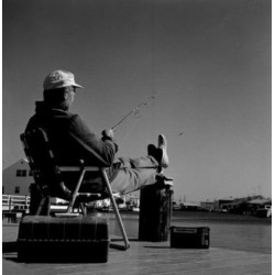 Posterazzi SAL255417827 Fisherman Sitting in Chair at the Edge of Water Poster Print - 18 x 24 in.