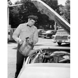 Posterazzi SAL2554346 Auto Mechanic Pouring Water in the Radiator of a Car Poster Print - 18 x 24 in.