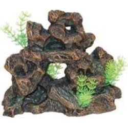 Stone Rock Formation With Plant