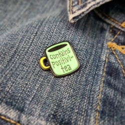 Contains Positivi Tea Enamel Pin