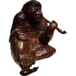 A Japanese Bronze Monkey Smoking A Pipe