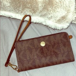 Michael Kors Bags | Iphone 5 Hand Wallet | Color: Brown | Size: Os found on Bargain Bro from poshmark, inc. for USD $28.88