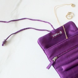 Compact silk travel jewellery roll in candy