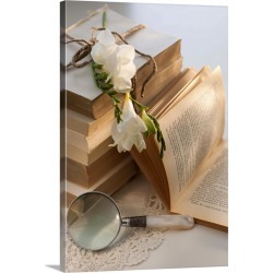 Large Solid-Faced Canvas Print Wall Art Print 20 x 30 entitled Magnifying glass beside stack of books with flowers