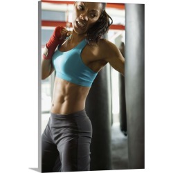 Large Solid-Faced Canvas Print Wall Art Print 20 x 30 entitled Woman hitting punching bag