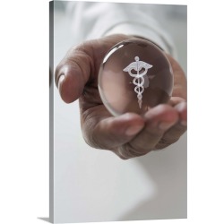 Large Solid-Faced Canvas Print Wall Art Print 20 x 30 entitled Close up of man holding clear ball with Caduceus symbol