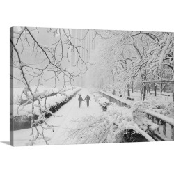 Large Gallery-Wrapped Canvas Wall Art Print 24 x 16 entitled Couple Walking Through Park In Snow
