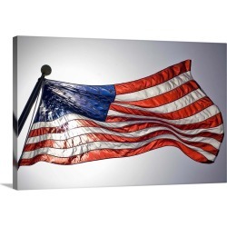 Large Solid-Faced Canvas Print Wall Art Print 30 x 20 entitled The American flag flies prominently