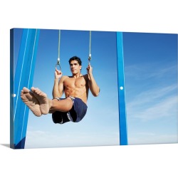 Large Solid-Faced Canvas Print Wall Art Print 30 x 20 entitled Man on a beach working out on exercise rings apparatus