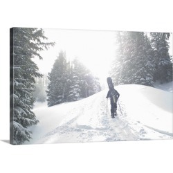 Large Solid-Faced Canvas Print Wall Art Print 30 x 20 entitled Man with snowboard hiking up mountain