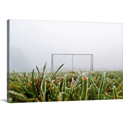 Large Solid-Faced Canvas Print Wall Art Print 30 x 20 entitled Frost and fog and football goal on soccer field.