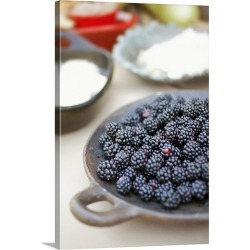 Large Solid-Faced Canvas Print Wall Art Print 20 x 30 entitled Close up of bowl of blackberries on a table with bowls of c...