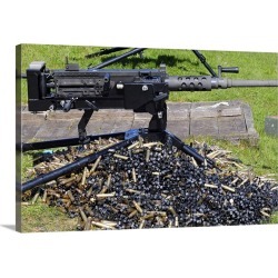 Large Gallery-Wrapped Canvas Wall Art Print 30 x 20 entitled A .50 Caliber Browning Machine Gun with a pile of spent cases...