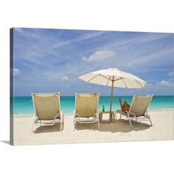 Large Solid-Faced Canvas Print Wall Art Print 30 x 20 entitled A woman in a beach chair under an umbrella giving the Peace...