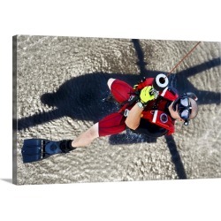 Large Solid-Faced Canvas Print Wall Art Print 30 x 20 entitled A rescue swimmer gets hoisted into an MH-60 Jayhawk helicopter